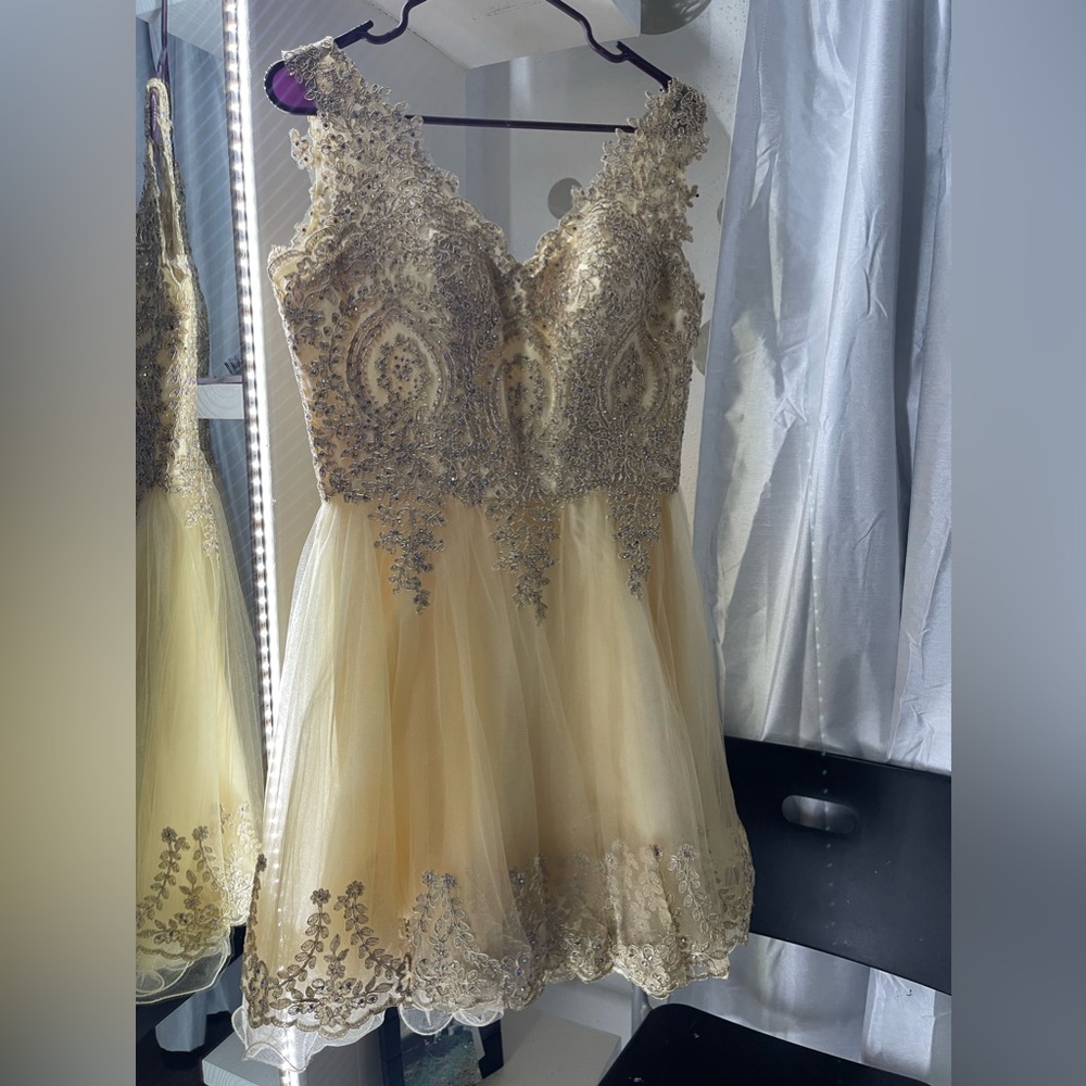 A beautiful champagne dress .
